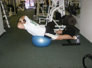 back strength training : reverse hyperextension on a ball