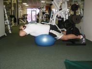 back strength training : reverse hyperextension on a ball